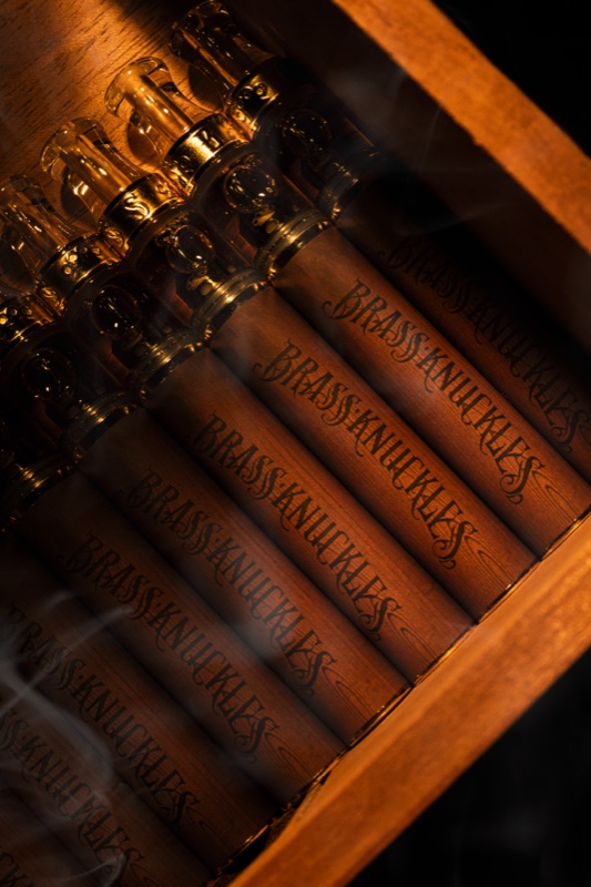 Cigars lined up in a wooden box